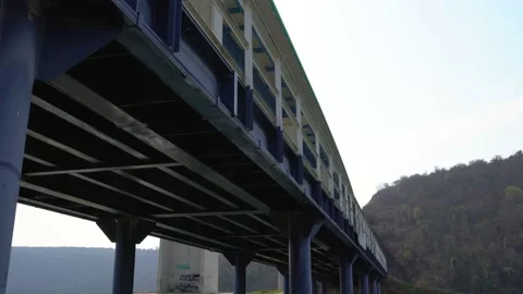 Small iron bridge in the foreground and the Mirna Bridge Stock Footage 178133217