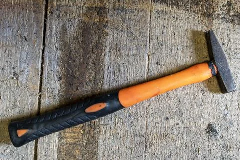 Small iron hammer with a long plastic handle for neat precise work 库存照片