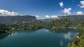 Small island with church amid mountain lake, beautiful Slovenia, timelapse 4k or 4k+ Resolution