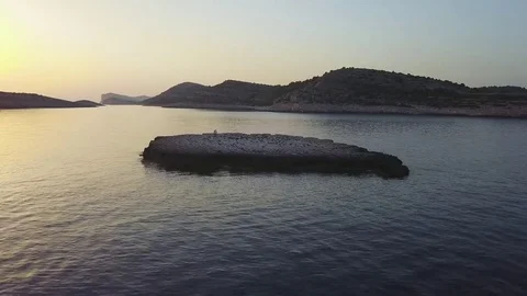 Small island at dusk Stock Footage 78598384