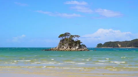 Small island in front of coast at Abel Tasman National Park Stock Footage 85490294