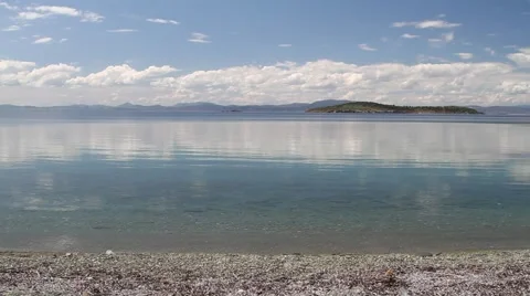 Small island on the horizon Stock Footage 40353216