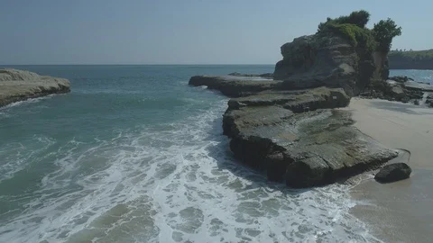 Small island in Klayar beach view in aerial footage Stock Footage 94101290