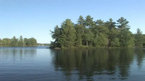 Small island on the lake Stock Footage 12325945