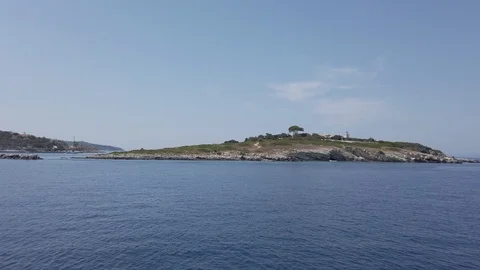 Small Island of Panagia next to port of Gaios with traditional Mediterranean Stock Footage 123722845