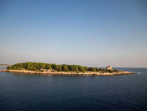 Small island with pine tree forest near island Vis in Croatia Stock Photos