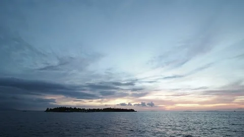 Small island silhouette at sunset Stock Footage 130434005
