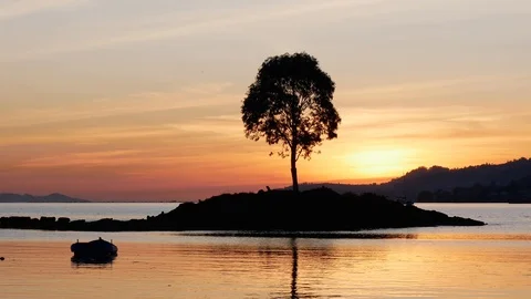 Small island at sunset Stock Footage 122096520