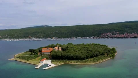Small Island surrounded by turquoise waters - Cinematic Aerial view Stock Footage 288818607