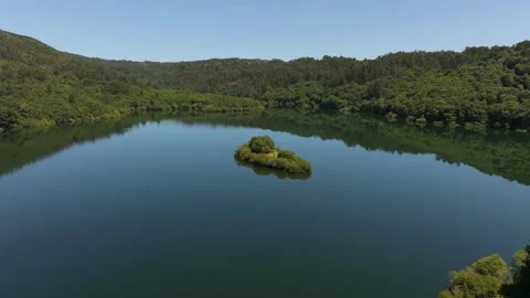 Small Island On Tranquil Waters Of Rio Oitaven Stock Footage 280835906