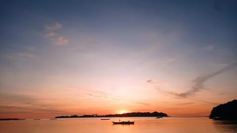 Small island view at sunset Stock Photos