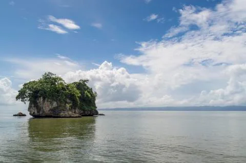 Small islands, cliffs, turned over with water, covered with green vegetation, Stock-Fotos