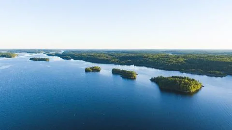 Small islands with a forest in the middle of a large lake aerial view Stock Photos