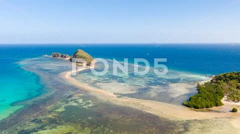 Small islands with a sand bar. Malay Archipelago, Philippines. Stock Photos