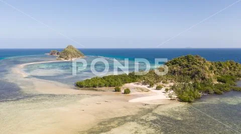 Small islands with a sand bar. Malay Archipelago, Philippines. Stock Photos