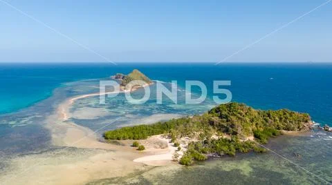 Small islands with a sand bar. Malay Archipelago, Philippines. Stock Photos
