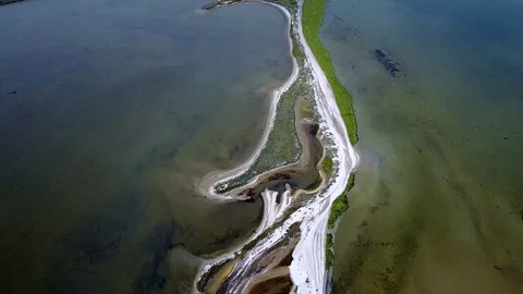 Small islands in shallow water. small island on a shoal of the Black Sea. Aerial Stock Footage 84675163
