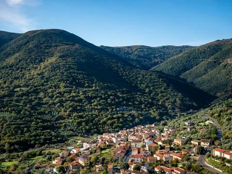 Small Italian town built between green hills Stock Photos