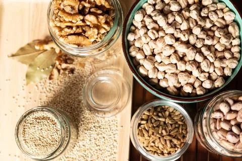 Small jar with quinoa on rustic table top view. Healthy food and snack. Stock Photos