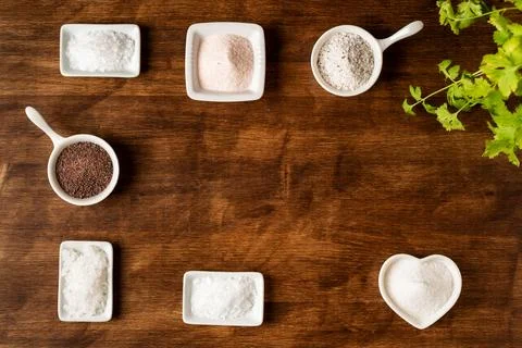 Small jars with different types of salt, black and pink from the Himalayas,.. Stock Photos