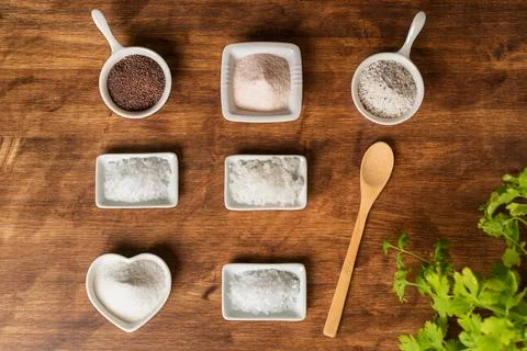 Small jars with different types of salt, black and pink from the Himalayas,.. Stock Photos