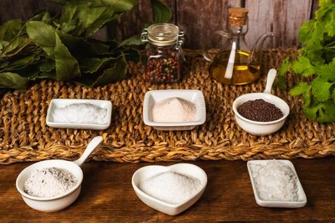 Small jars with different types of salt, black and pink from the Himalayas,.. Stock Photos