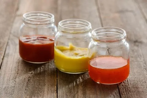 Small jars of sauces Stock Photos