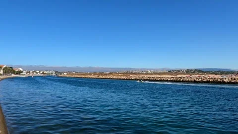 Small jet ski gliding on a river in Portugal Stock Footage 285138959
