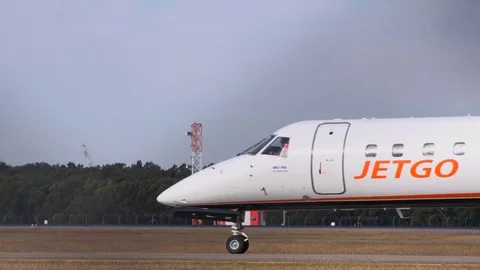 Small  Jet Taxiing Through Frame Stock Footage 79162288