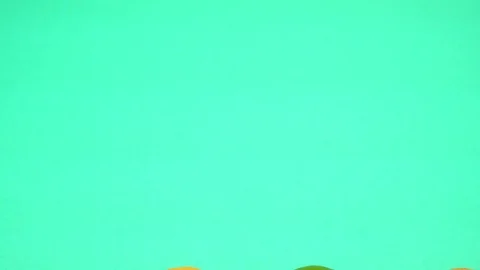 Small juicy tangerines on a bright multi-colored background. Close-up, top view Stock Footage 122002371