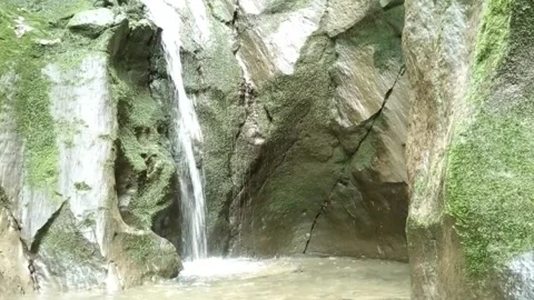 Small Jungle Waterfall Flowing Into Clear Pool Stock Footage 330327519