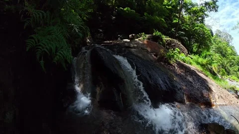Small jungle waterfall over dark rock. Dauin, Negros Oriental. Philippines. Stock Footage 321103652