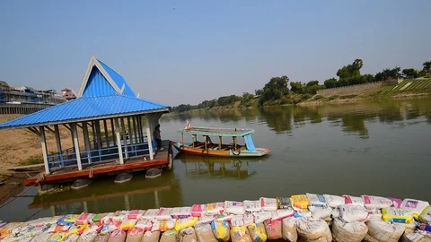 A small junk boat cruises through the boat, suggesting to go to the pier. Video stock 122411241