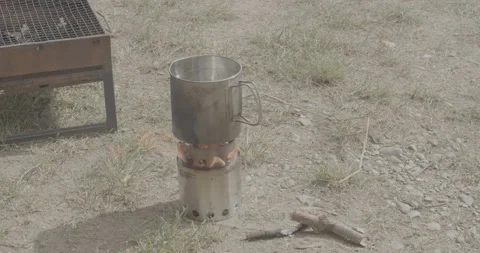 Small kettle fire, camping, rocket stove Stock Footage 150739994