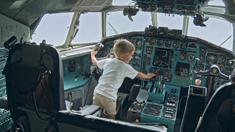 Small kid on the cabin of an airplane Video stock 117518164