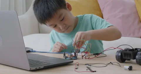 Small kid children coding scratch car upskill STEAM lifestyle at home. Видео 164416102