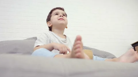 Small Kid Eating Dry Breakfast And Watching TV Stock Footage 239066594