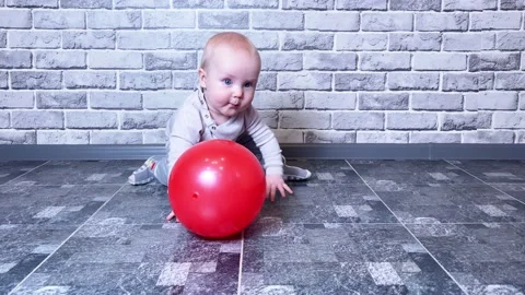 Small kid playing with red ball Stock Footage 172359615