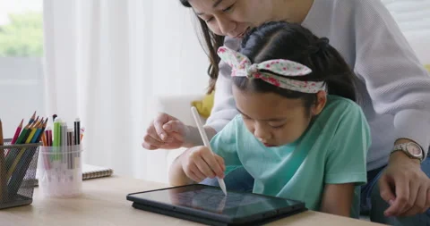 Small kid sit at home table sofa fun play sketch on tablet computer. 스톡 동영상 170096015