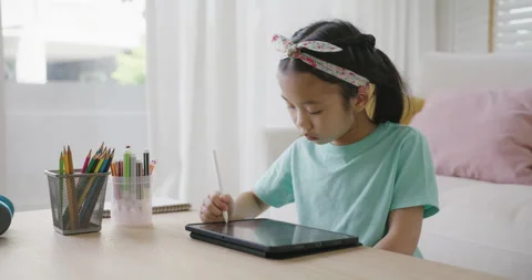 Small kid  sit at home table sofa playing on touch screen computer. 스톡 동영상 171511851