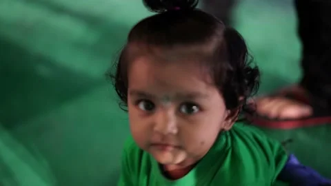 Small kids walking on ground during the Garba function 스톡 동영상 231532861