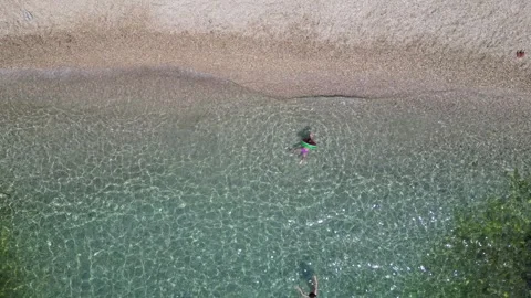 Small kinds swimming in deep blue amazing clean private beach in Saranda ri.. Stock Footage 252765958