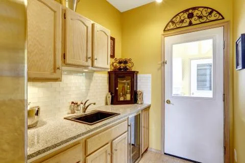 Small kitchen area with moden cabinets Stock Photos
