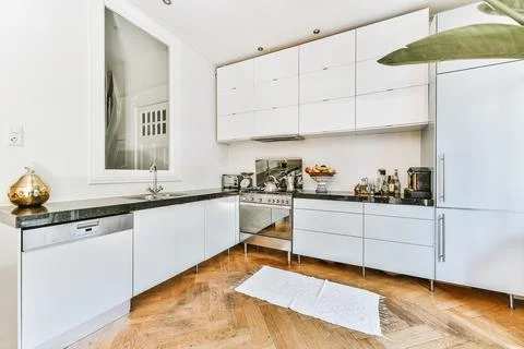 Small kitchen interior in modern apartment Stock Photos