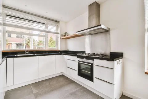 Small kitchen interior in modern apartment Stock Photos