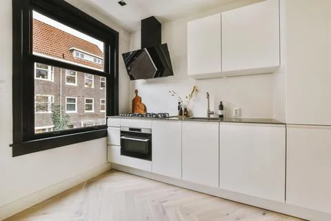 Small kitchen interior in modern apartment Stock Photos
