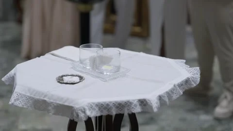Small Lace Covered Table With Glass Bowls And Silver Dish In A Church Stock Footage 343704492