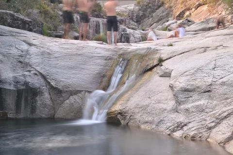 Small lagoon with a small waterfall located in the Geres mountains in Portugal Stock Photos