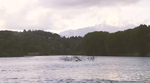 Small Lake and Mountains in the Background Stock Footage 62738713