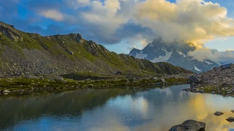 Small lake on the mountain pass at the evening, time lapse scene Stock Footage 102220568